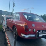 Vehicle transport service carrying a classic car